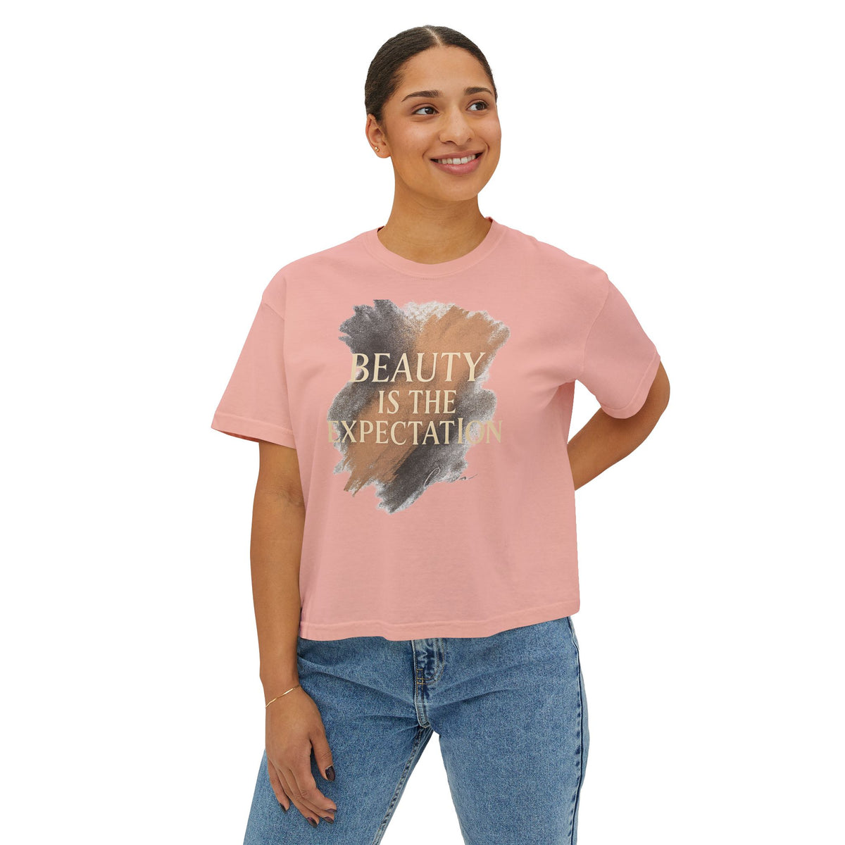 A woman wearing the Beauty Is the Expectation Boxy Tee in Peach Color | Pretty & Petty | Pretty and Petty